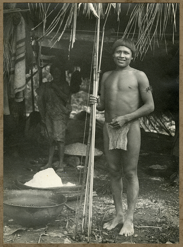 An indian warrior in front of his hut, 1938.